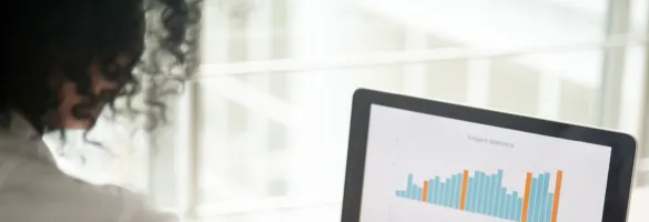 a woman typing on a laptop