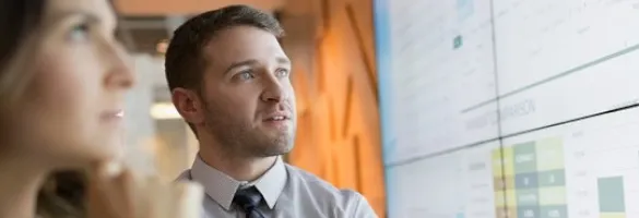 a man looking at a computer screen