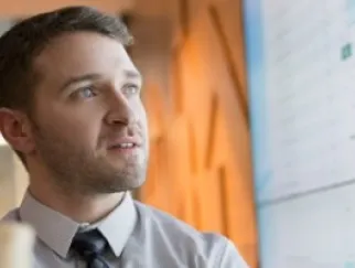a man looking at a computer screen