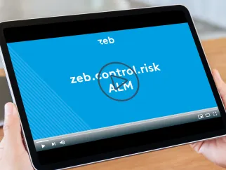 a hand holding a tablet