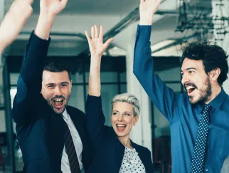 a group of people with their hands up