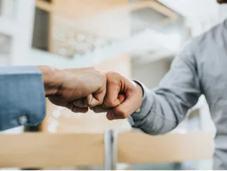 a close-up of two hands shaking