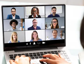 a group of people on a laptop
